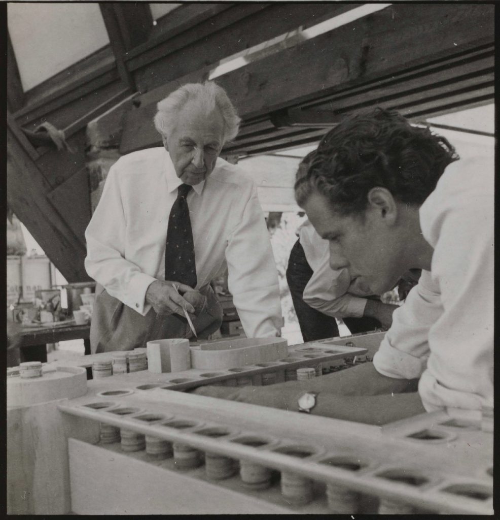 Model building at Taliesin West, Frank Lloyd Wright with apprentices.