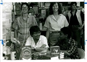 Mary Day at Women and Children First bookstore. Behind her are owners Ann Christopherson and Linda Bubon. Photographs of anonymous women in a bookstore, Tracy Baim Editorial Files. LGBT Thought & Culture