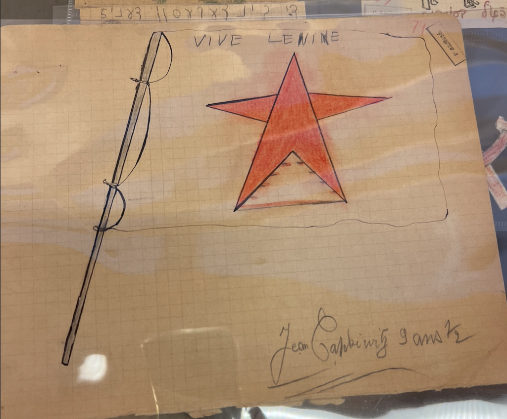 Child's drawing of a flag with a red star and "Vive Lenine" 