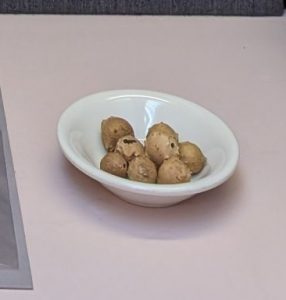 Iron gall ink balls in a ceramic bowl