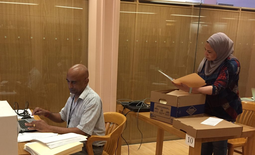 Rajendran T. Govender of the Kwazulu-Natal Department of Arts and Culture, South Africa, and Nagah Sayed-Ahmed, an independent social science researcher and activist from Egypt, consult the paper records of the Ford IFP Archive in the reading room at the Rare Book and Manuscript Library.