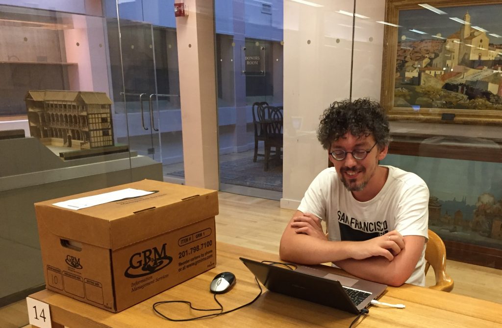 Wim de Jong of Radboud University Nijmegen, the Netherlands, pauses to review his notes after examining a box of paper records from the Ford IFP Archive.