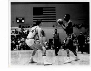 Columbia's Jim MacMillan tries to elude Princeton's Geoff Petrie. 