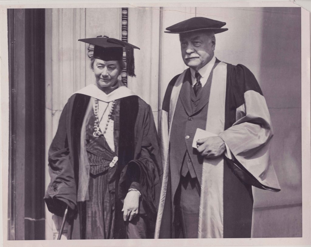 woman and man in graduation caps and gowns