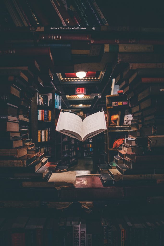 bookstore shelves with levitating book